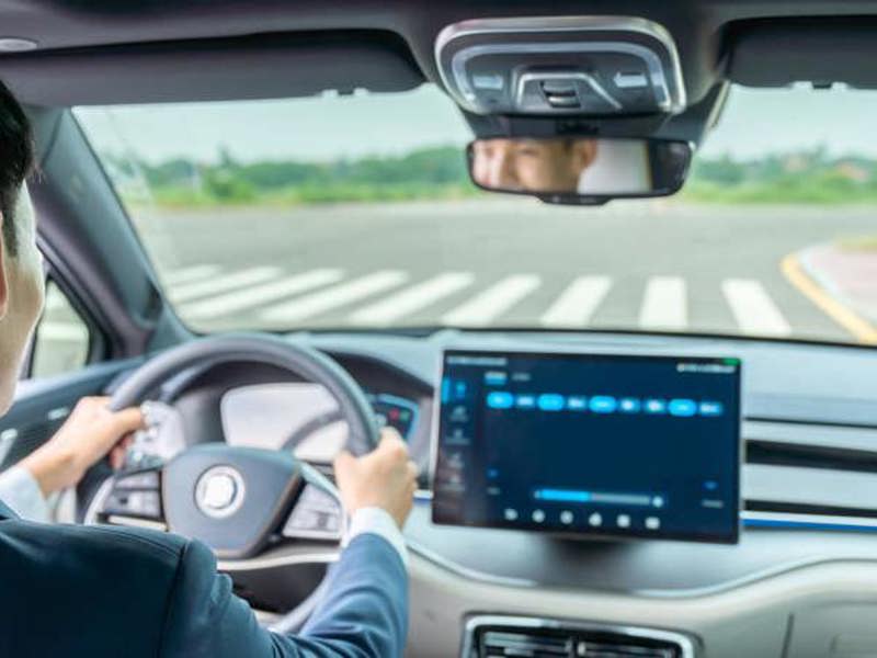 Male EV driver on the road.